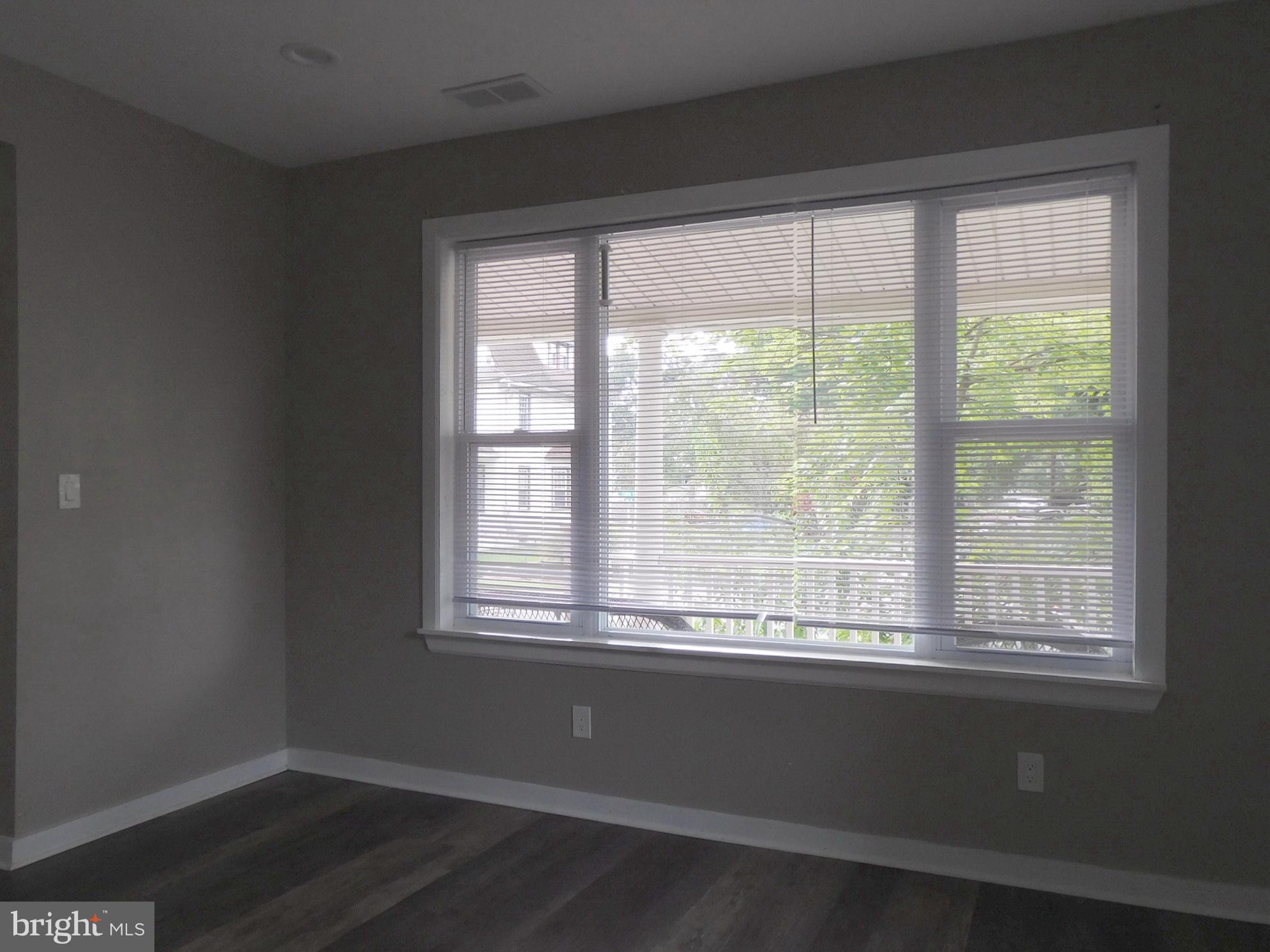 623 3rd Street Delanco, NJ 08075 - Photo 34 of 44 a view of an empty room with wooden floor and a window