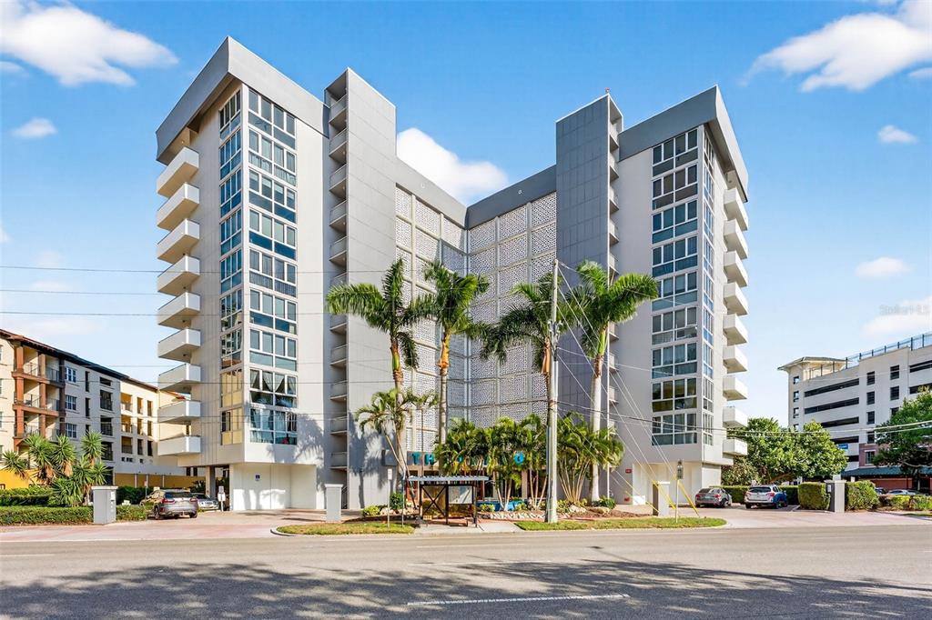 470 3rd Street South, Unit 318 St. Petersburg, FL 33701 - Photo 1 of 45 a front view of multi story residential apartment building with yard and traffic signal