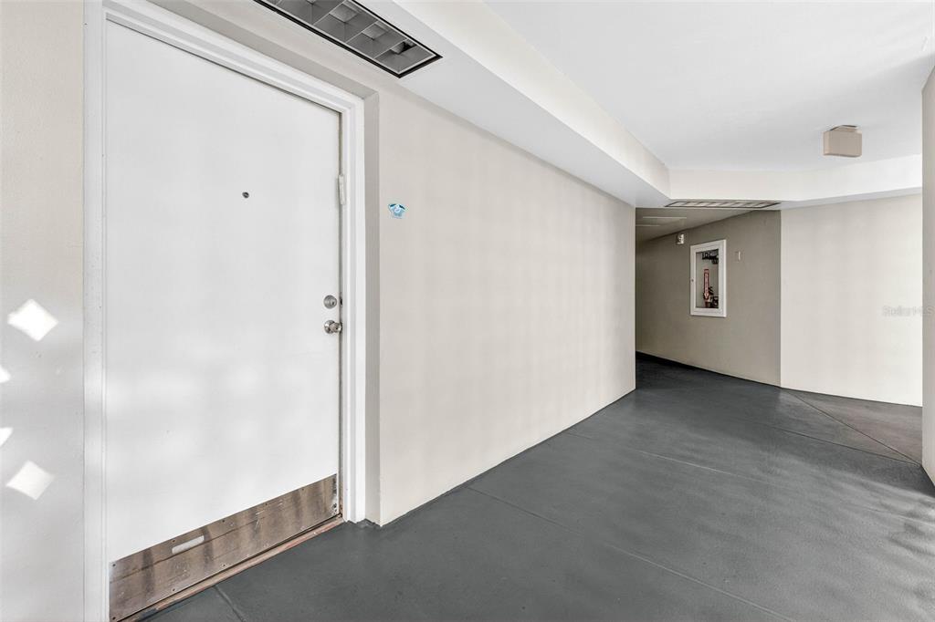 470 3rd Street South, Unit 318 St. Petersburg, FL 33701 - Photo 11 of 45 a view of a hallway with wooden floor