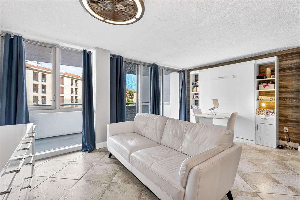 470 3rd Street South, Unit 318 St. Petersburg, FL 33701 - Photo 20 of 45 a living room with furniture and a window