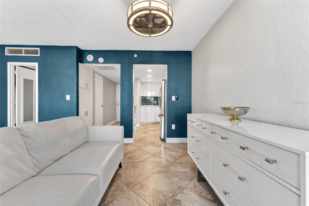 470 3rd Street South, Unit 318 St. Petersburg, FL 33701 - Photo 23 of 45 a bedroom with a bed and a dresser