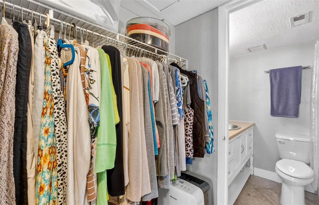 470 3rd Street South, Unit 318 St. Petersburg, FL 33701 - Photo 27 of 45 a view of walk in closet with clothes
