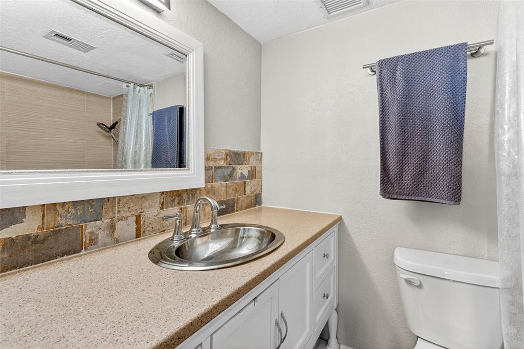 470 3rd Street South, Unit 318 St. Petersburg, FL 33701 - Photo 29 of 45 a bathroom with a sink and a toilet