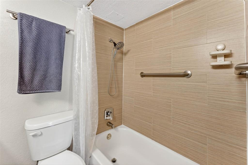 470 3rd Street South, Unit 318 St. Petersburg, FL 33701 - Photo 30 of 45 a bathroom with a toilet and a shower