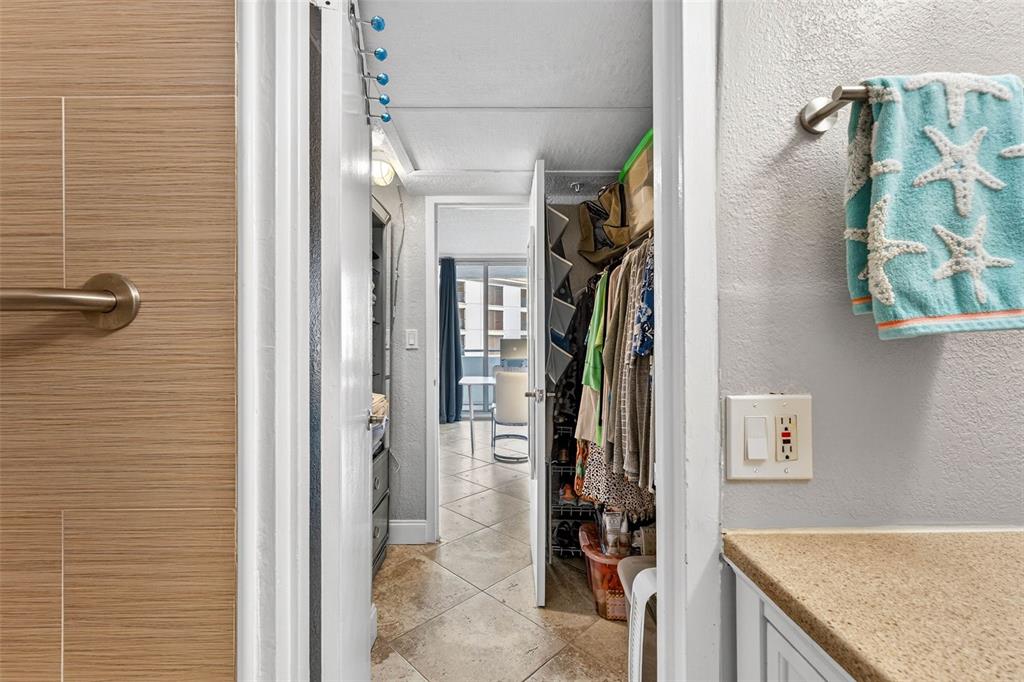 470 3rd Street South, Unit 318 St. Petersburg, FL 33701 - Photo 31 of 45 a view of a walk in closet and bathroom