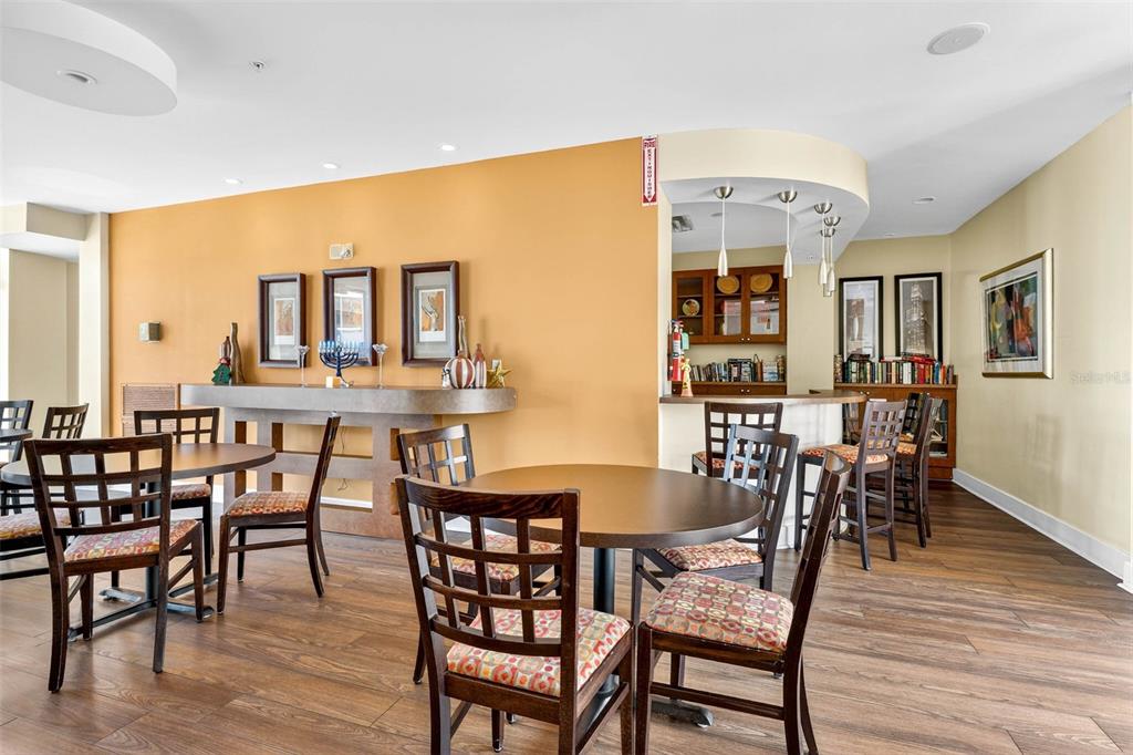 470 3rd Street South, Unit 318 St. Petersburg, FL 33701 - Photo 36 of 45 a view of a dining room with furniture and wooden floor