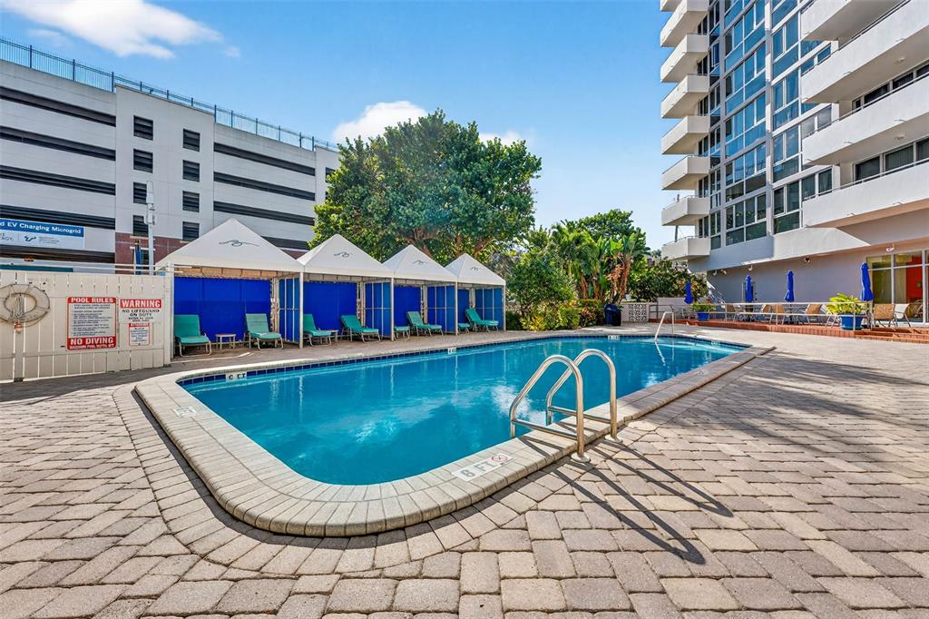 470 3rd Street South, Unit 318 St. Petersburg, FL 33701 - Photo 39 of 45 a view of swimming pool with a lounge chairs