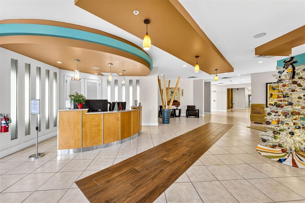470 3rd Street South, Unit 318 St. Petersburg, FL 33701 - Photo 6 of 45 a lobby with furniture and wooden floor