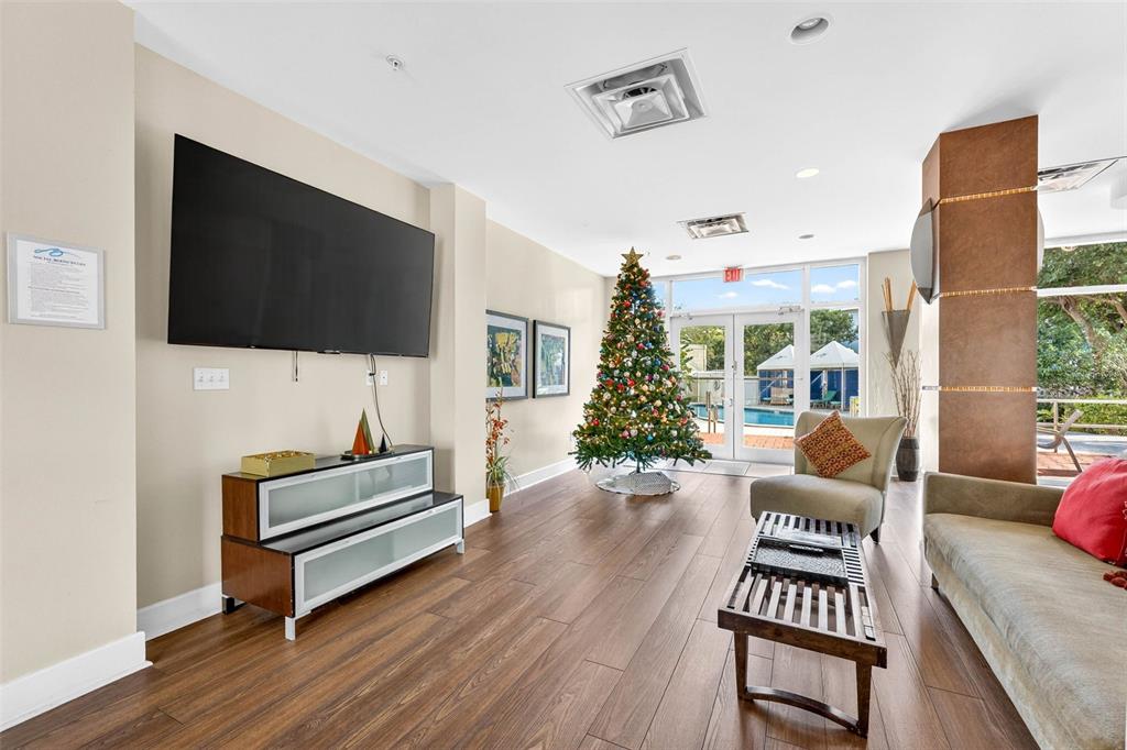 470 3rd Street South, Unit 318 St. Petersburg, FL 33701 - Photo 8 of 45 a living room with furniture and a flat screen tv