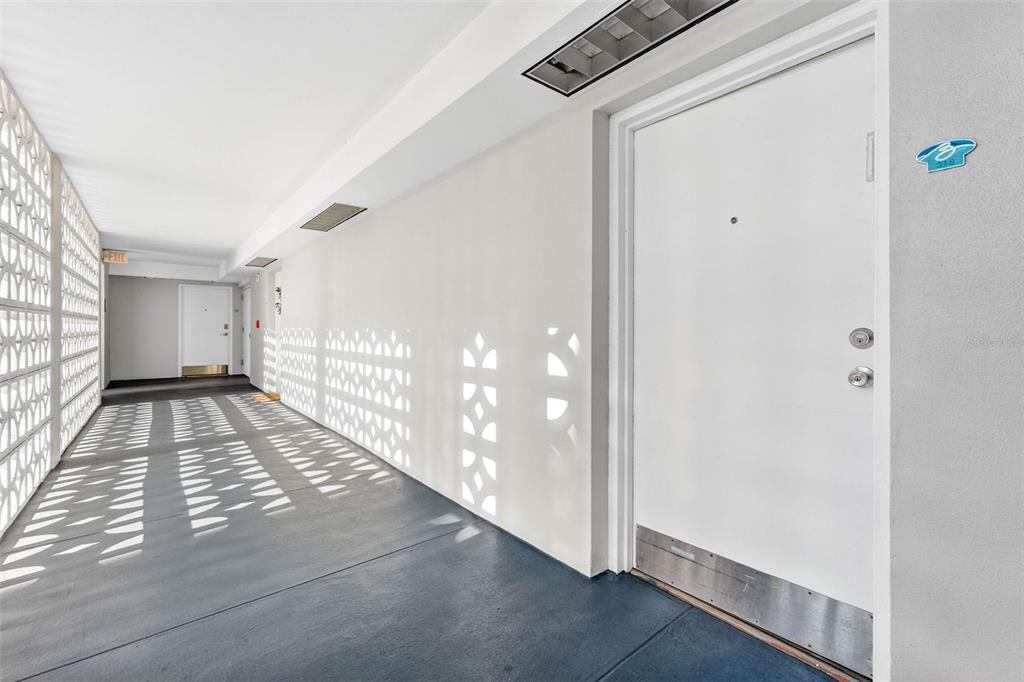 470 3rd Street South, Unit 318 St. Petersburg, FL 33701 - Photo 10 of 45 a view of a hallway with windows