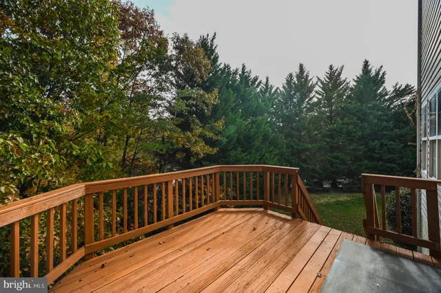 a view of a porch with wooden floor