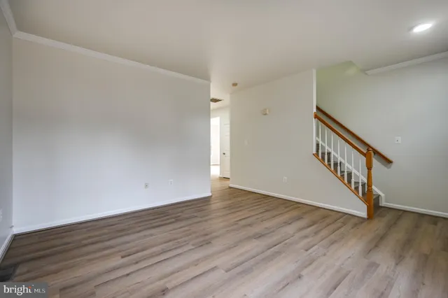 a view of an entryway with wooden floor