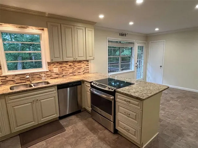 a kitchen that has a sink and a window