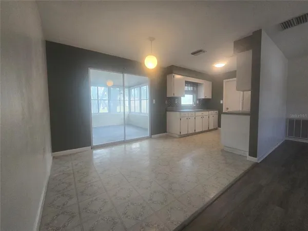 a view of a kitchen with a sink and a window