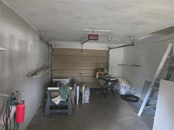 view of a hallway with cabinet and cabinet