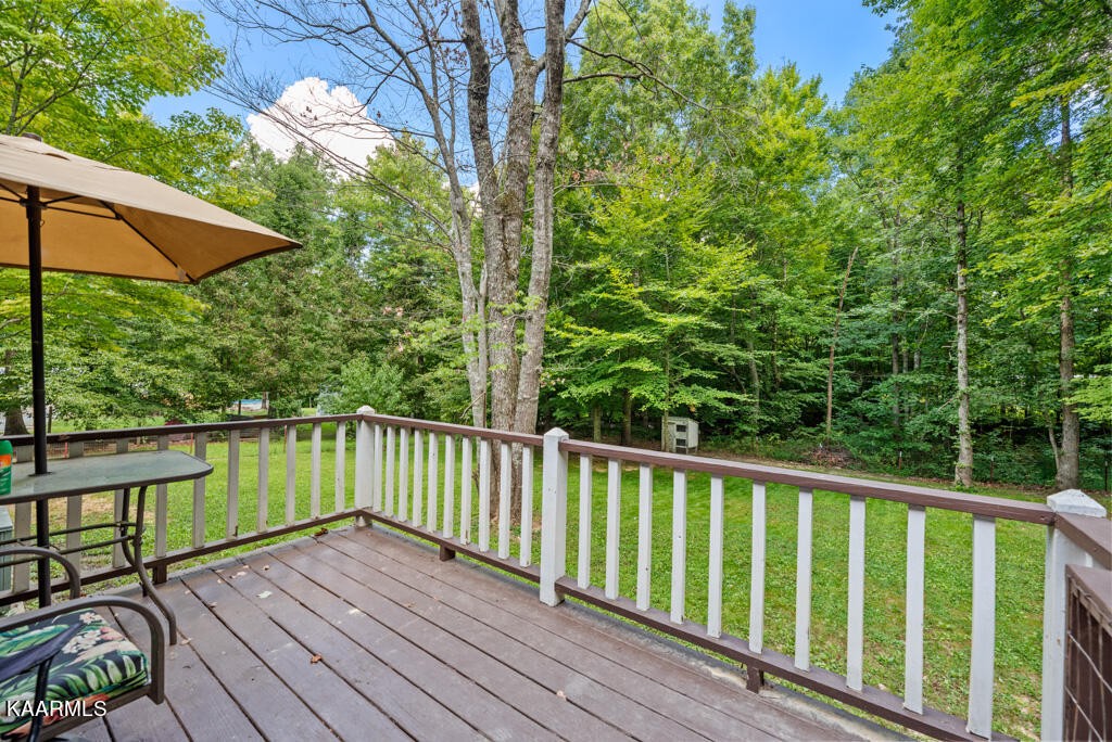 707 Jane Phillips Road Oneida, TN 37841 - Photo 21 of 25 a view of balcony with wooden floor and fence