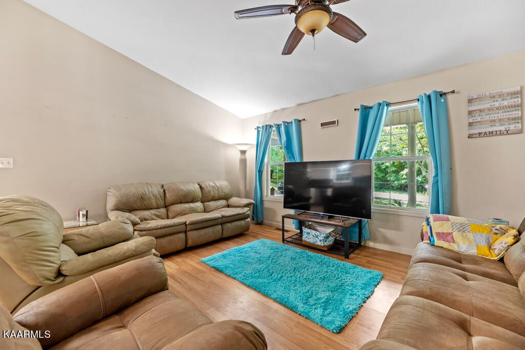 707 Jane Phillips Road Oneida, TN 37841 - Photo 6 of 25 a living room with furniture and a flat screen tv