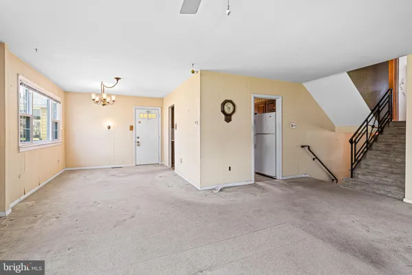a view of an empty room with a fireplace