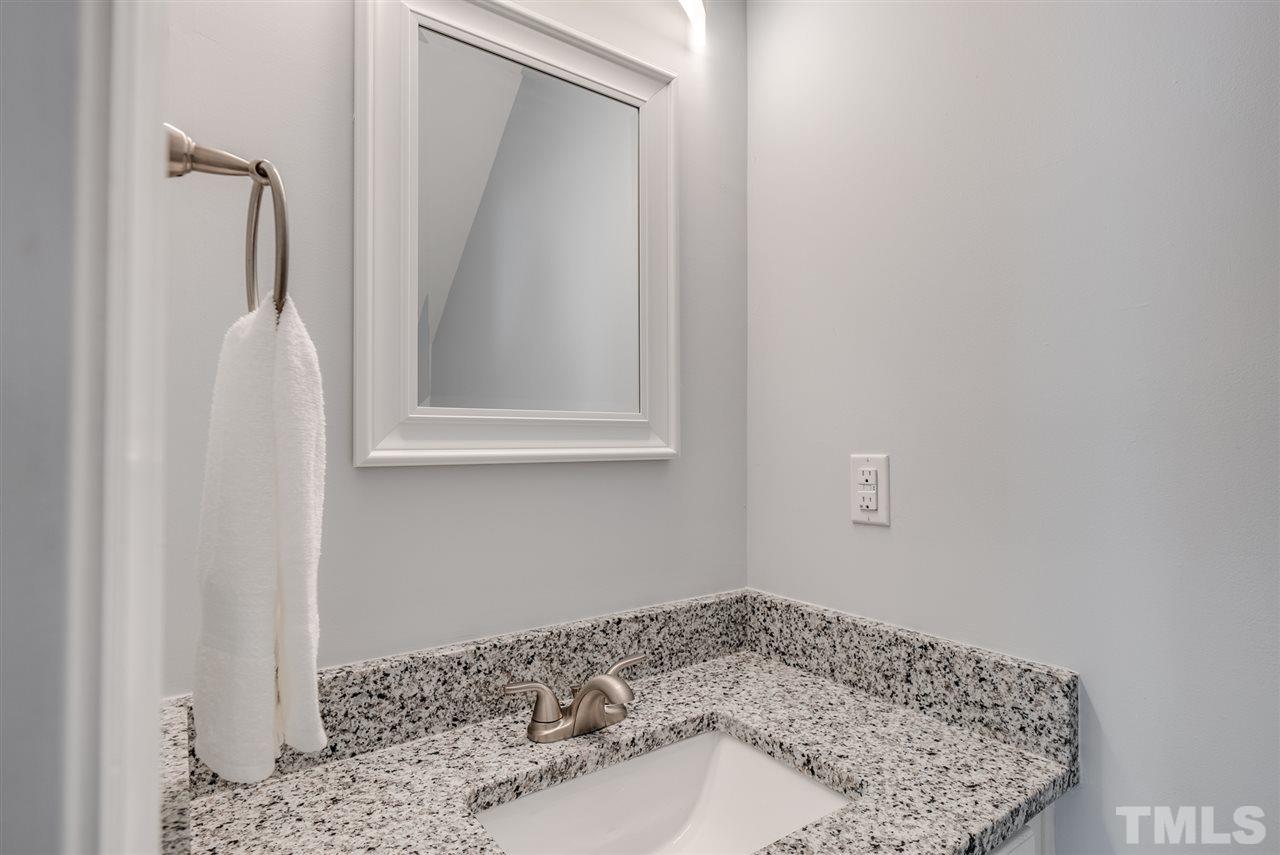 5408 Gunnette Drive Raleigh, NC 27610 - Photo 11 of 23 a bathroom with a sink and a mirror