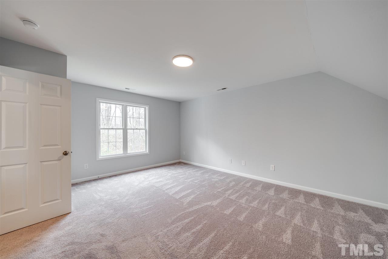 5408 Gunnette Drive Raleigh, NC 27610 - Photo 12 of 23 wooden floor in an empty room with a window