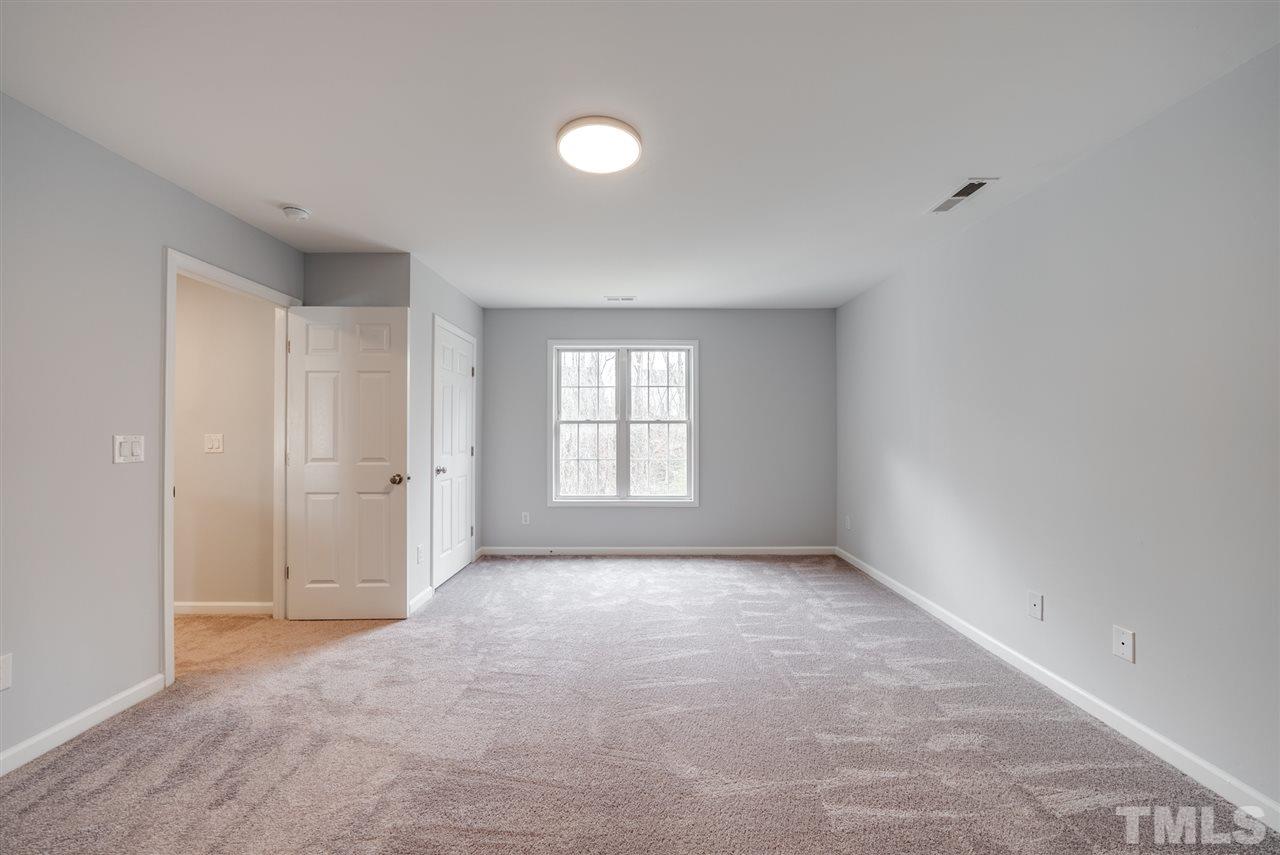 5408 Gunnette Drive Raleigh, NC 27610 - Photo 13 of 23 a view of empty room with window