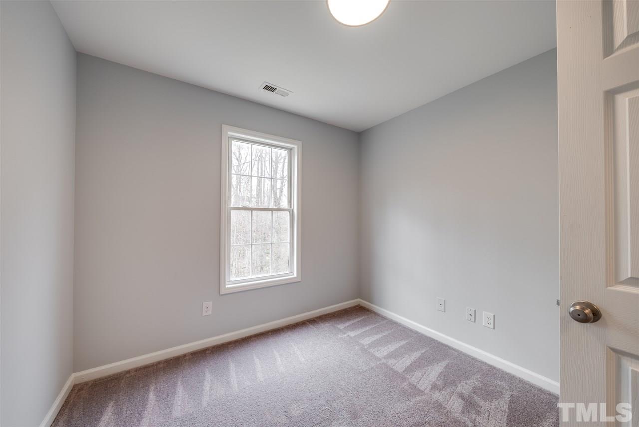 5408 Gunnette Drive Raleigh, NC 27610 - Photo 14 of 23 an empty room with a window