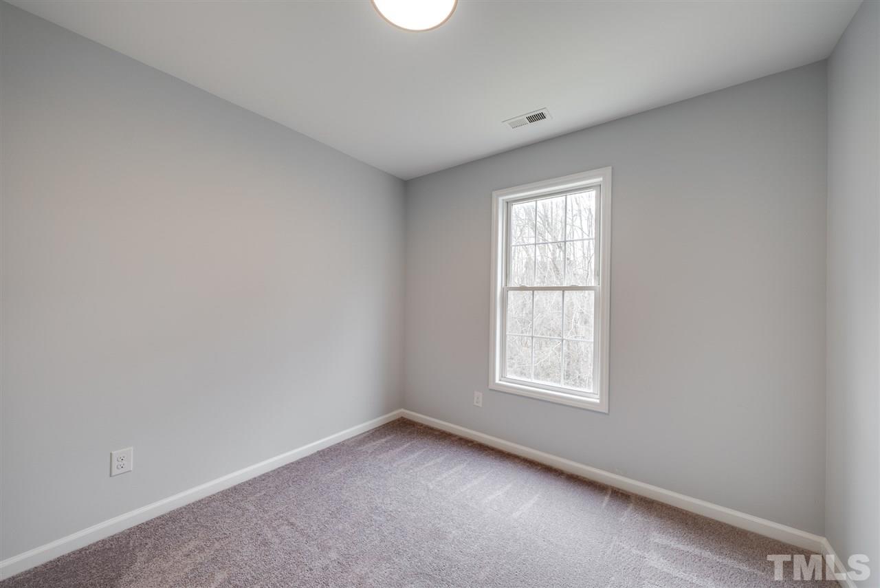5408 Gunnette Drive Raleigh, NC 27610 - Photo 15 of 23 an empty room with a window