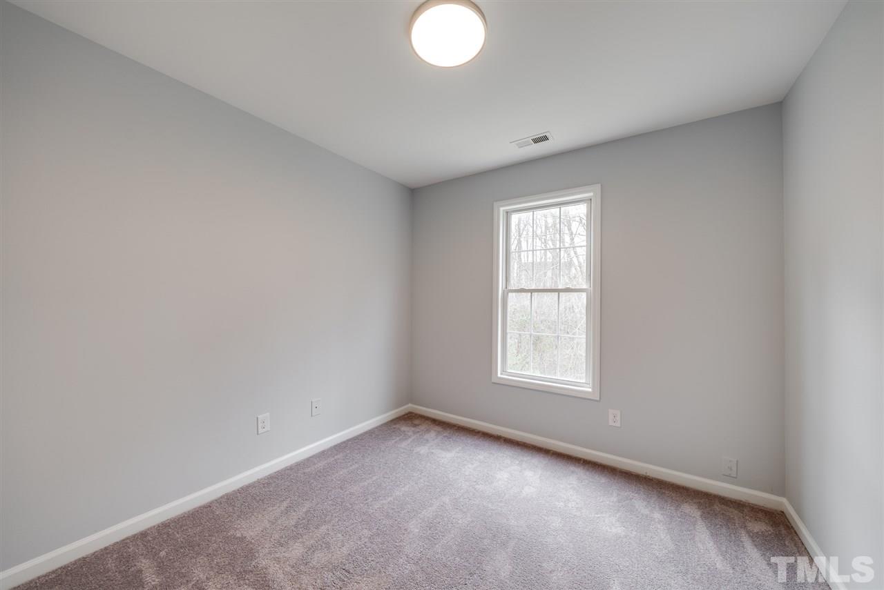 5408 Gunnette Drive Raleigh, NC 27610 - Photo 16 of 23 an empty room with a window