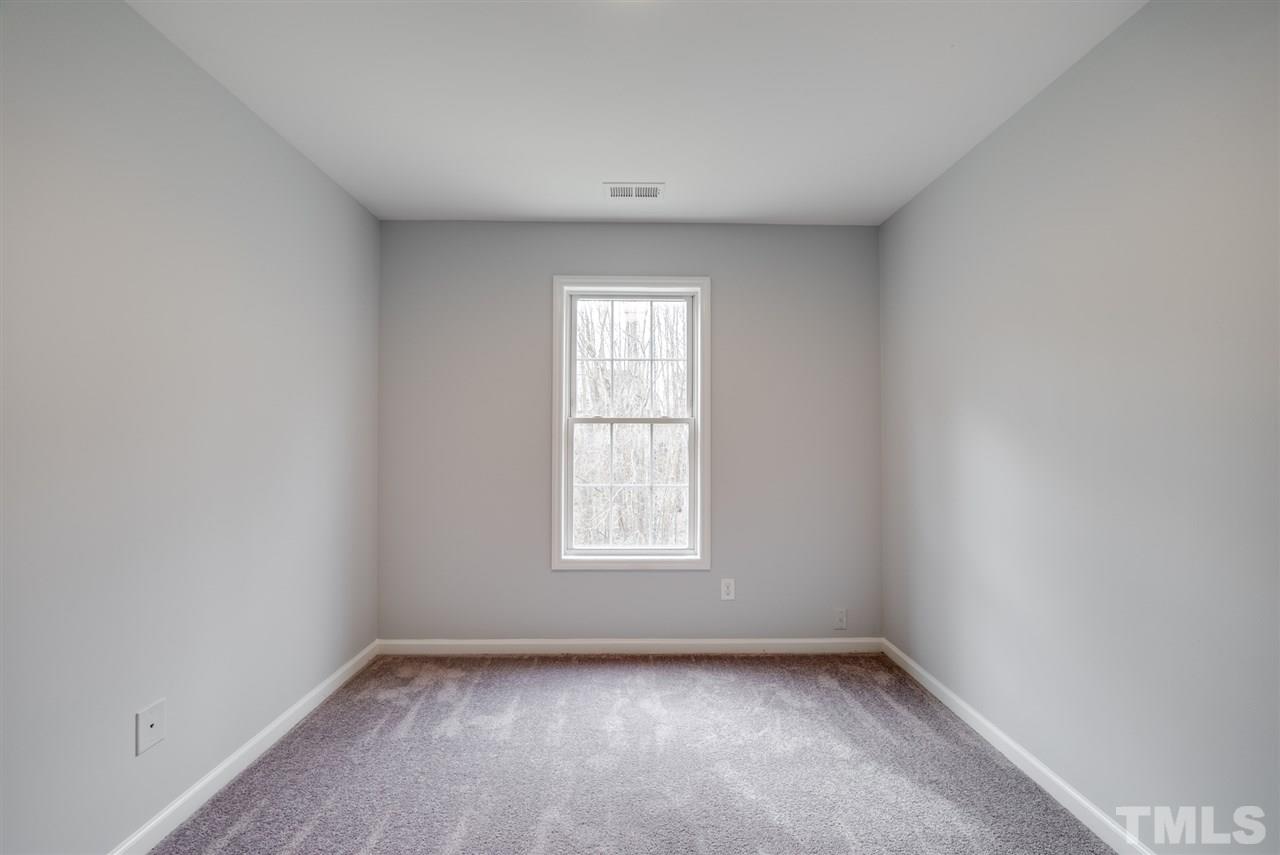 5408 Gunnette Drive Raleigh, NC 27610 - Photo 17 of 23 an empty room with a window
