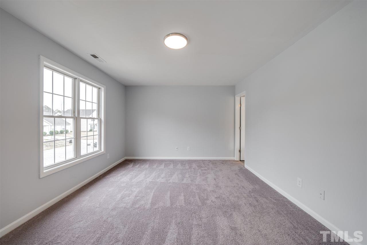 5408 Gunnette Drive Raleigh, NC 27610 - Photo 19 of 23 an empty room with windows and closet