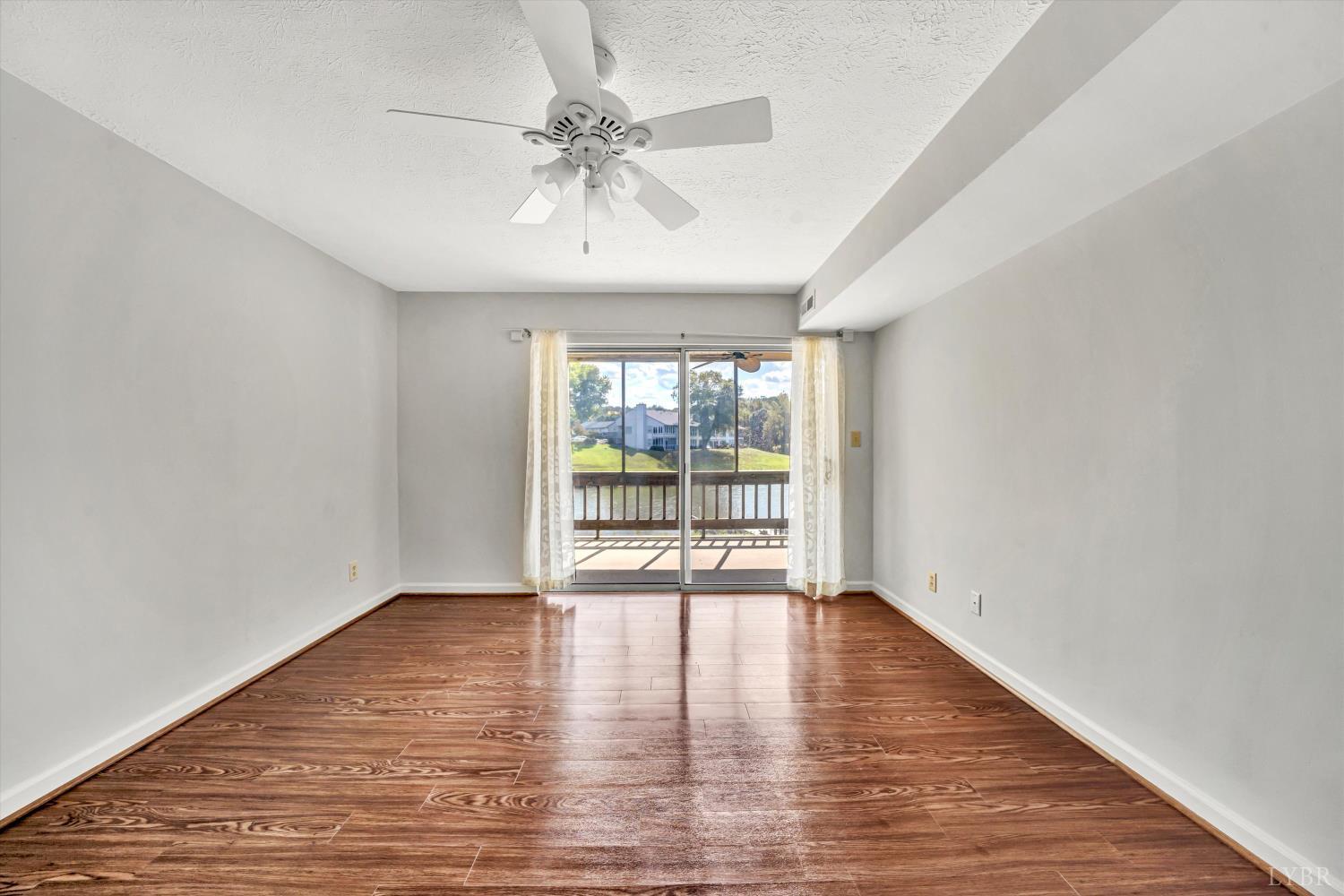 3114 Spinnaker Point Forest, VA 24551 - Photo 22 of 47 a view of an empty room with wooden floor and a window