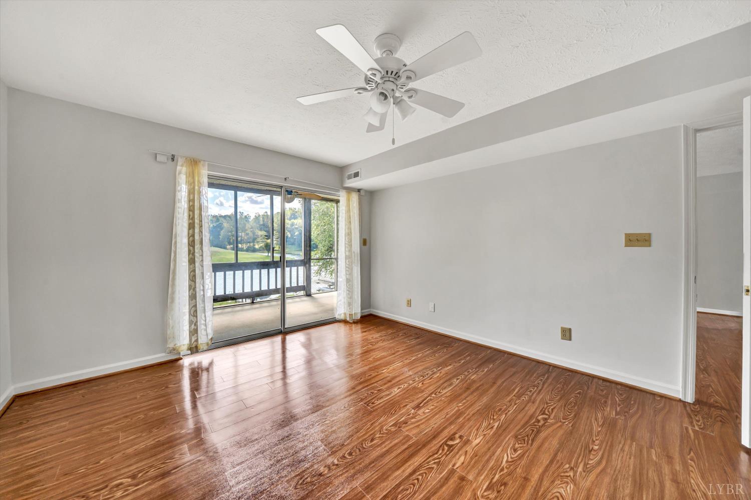 3114 Spinnaker Point Forest, VA 24551 - Photo 24 of 47 a view of an empty room with wooden floor and a window