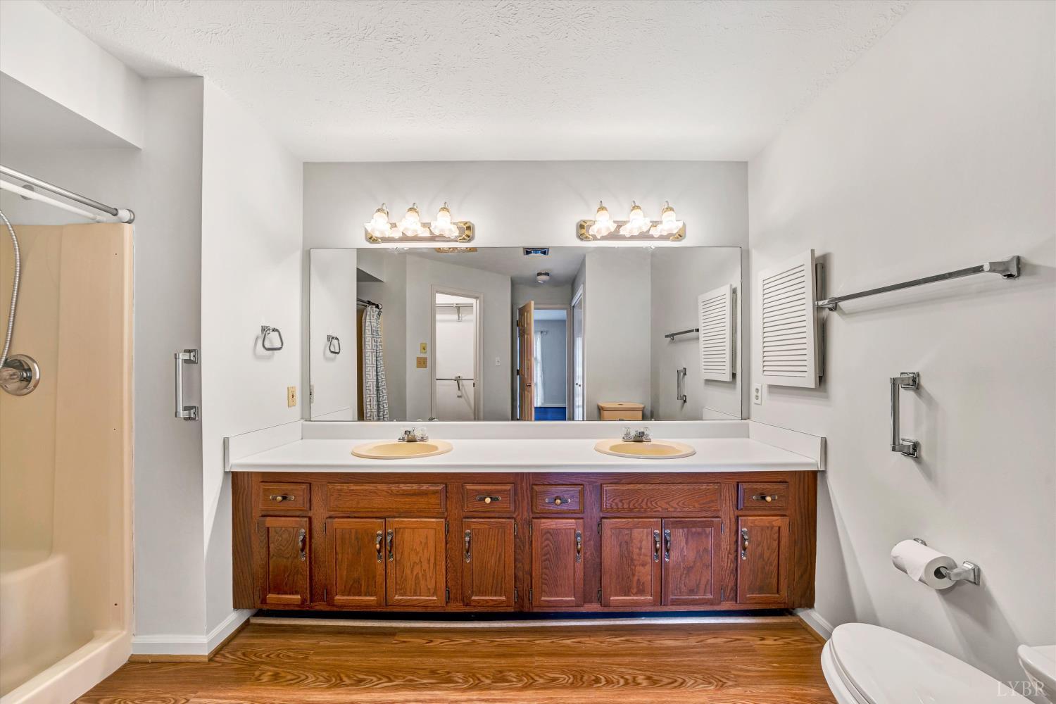 3114 Spinnaker Point Forest, VA 24551 - Photo 25 of 47 a bathroom with a sink a toilet a mirror and shower