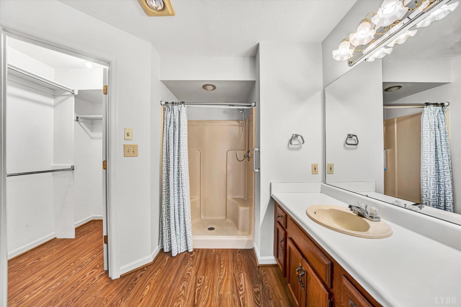 3114 Spinnaker Point Forest, VA 24551 - Photo 26 of 47 a bathroom with a sink a mirror and a shower