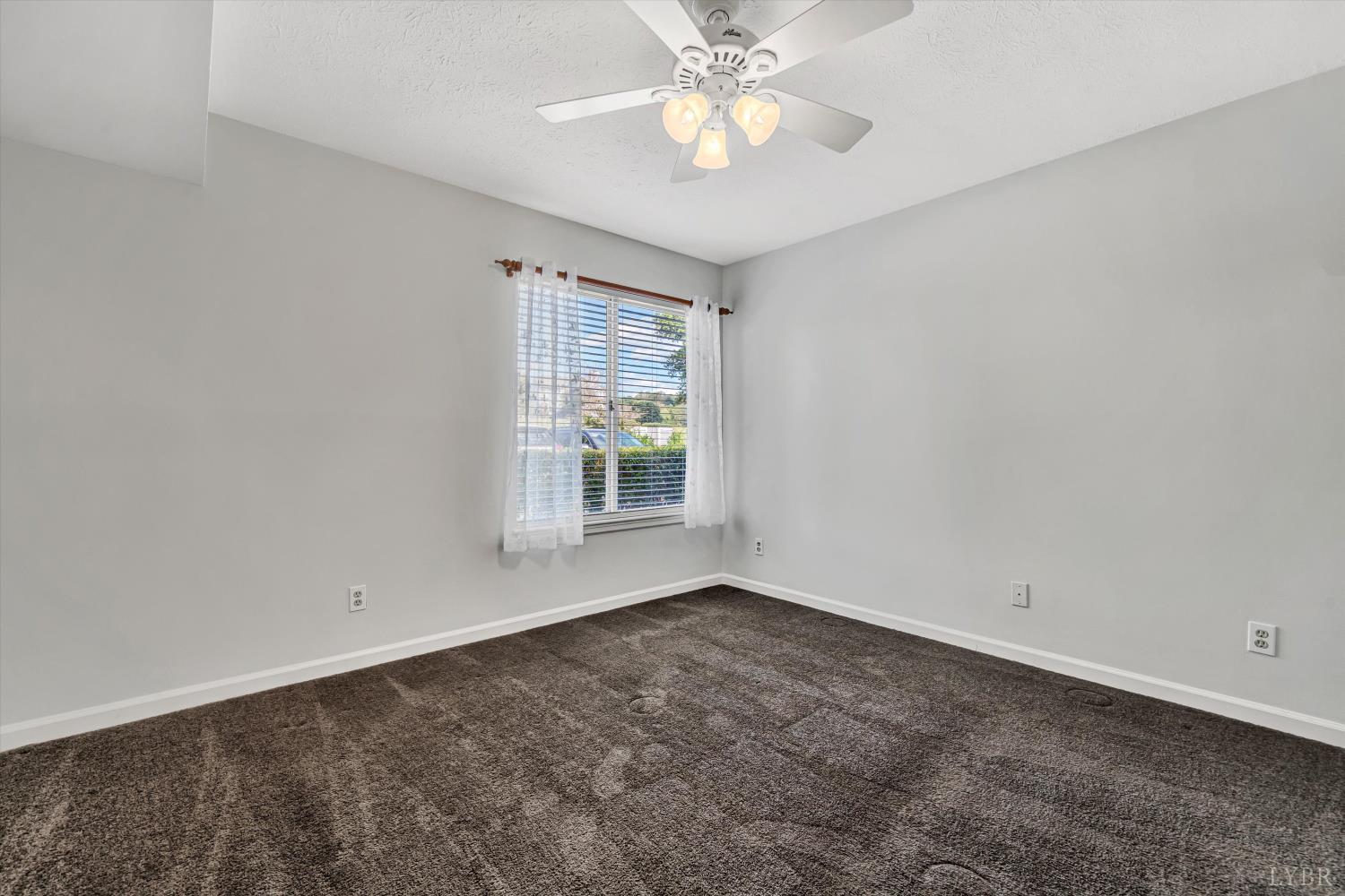 3114 Spinnaker Point Forest, VA 24551 - Photo 29 of 47 an empty room with a window and a fan