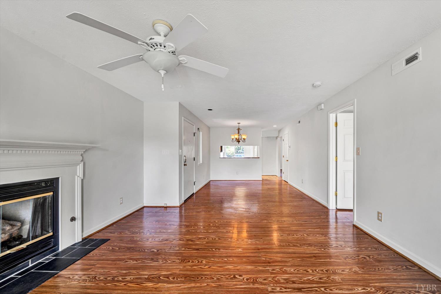3114 Spinnaker Point Forest, VA 24551 - Photo 9 of 47 a view of empty room with wooden floor and fireplace