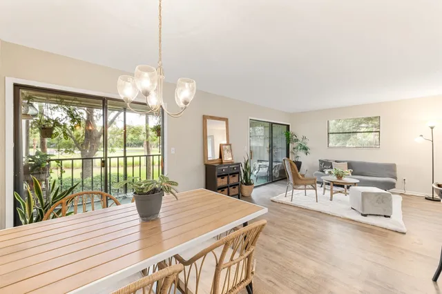 a dining room with furniture and wooden floor