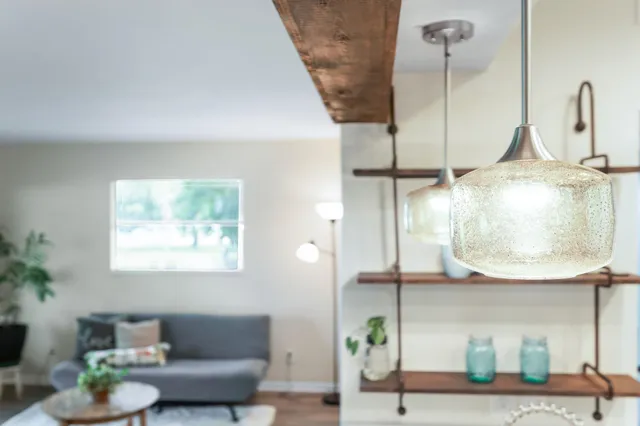 a kitchen with cabinets and steel stainless steel appliances
