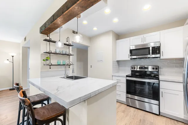 a bathroom with a potted plant