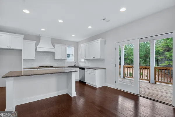 a view of a balcony with wooden floor and outdoor space