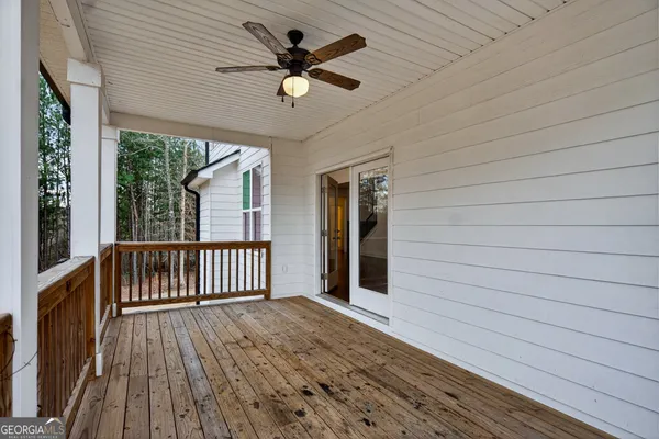 a room with a window and a chandelier