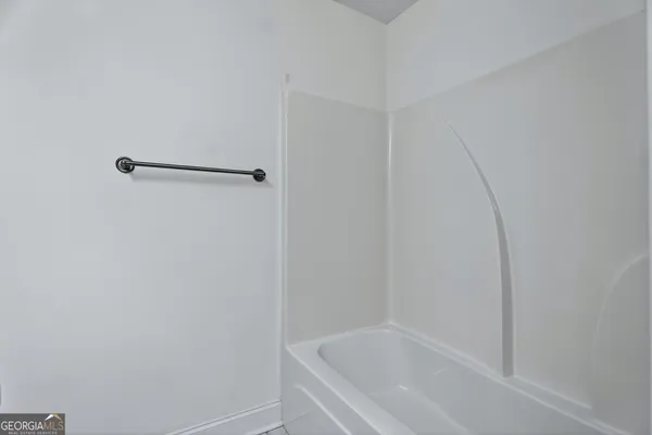 a view of room with wooden floor and window