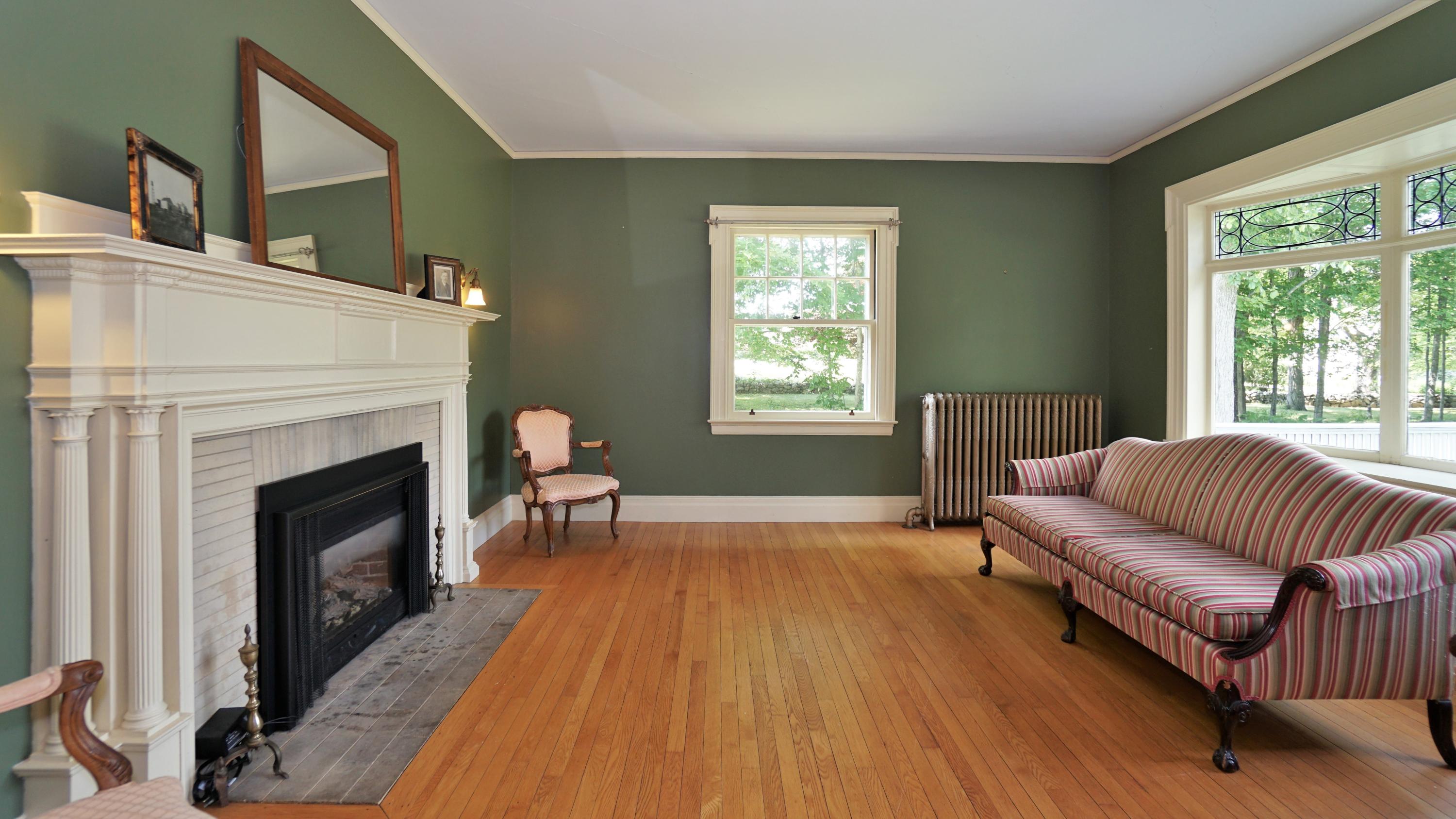 337 Intervale Road New Gloucester, ME 04260 - Photo 7 of 86 Parlor with fireplace and leaded windows