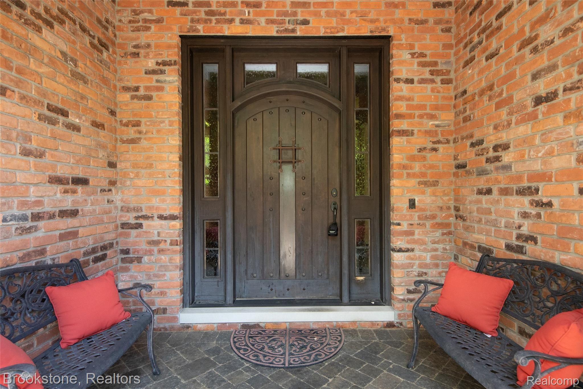 7868 Holcomb Road Clarkston, MI 48348 - Photo 15 of 60 Mahogany Door Welcomes Guests
