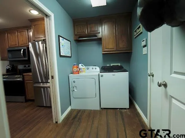 a bathroom with a granite countertop toilet sink and mirror
