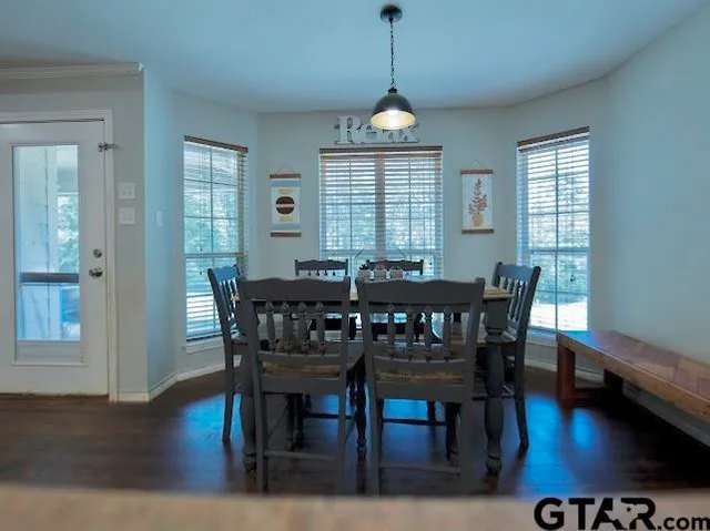 a room with table and chairs