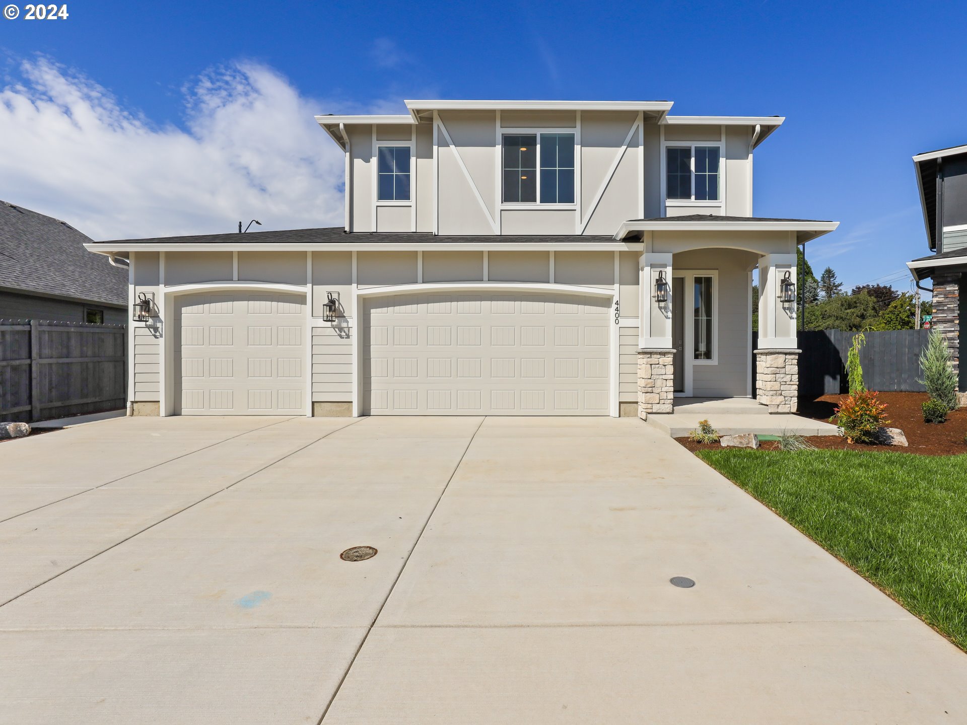 4400 North 12th Way Ridgefield, WA 98642 - Photo 1 of 31 a front view of a house with a yard and garage