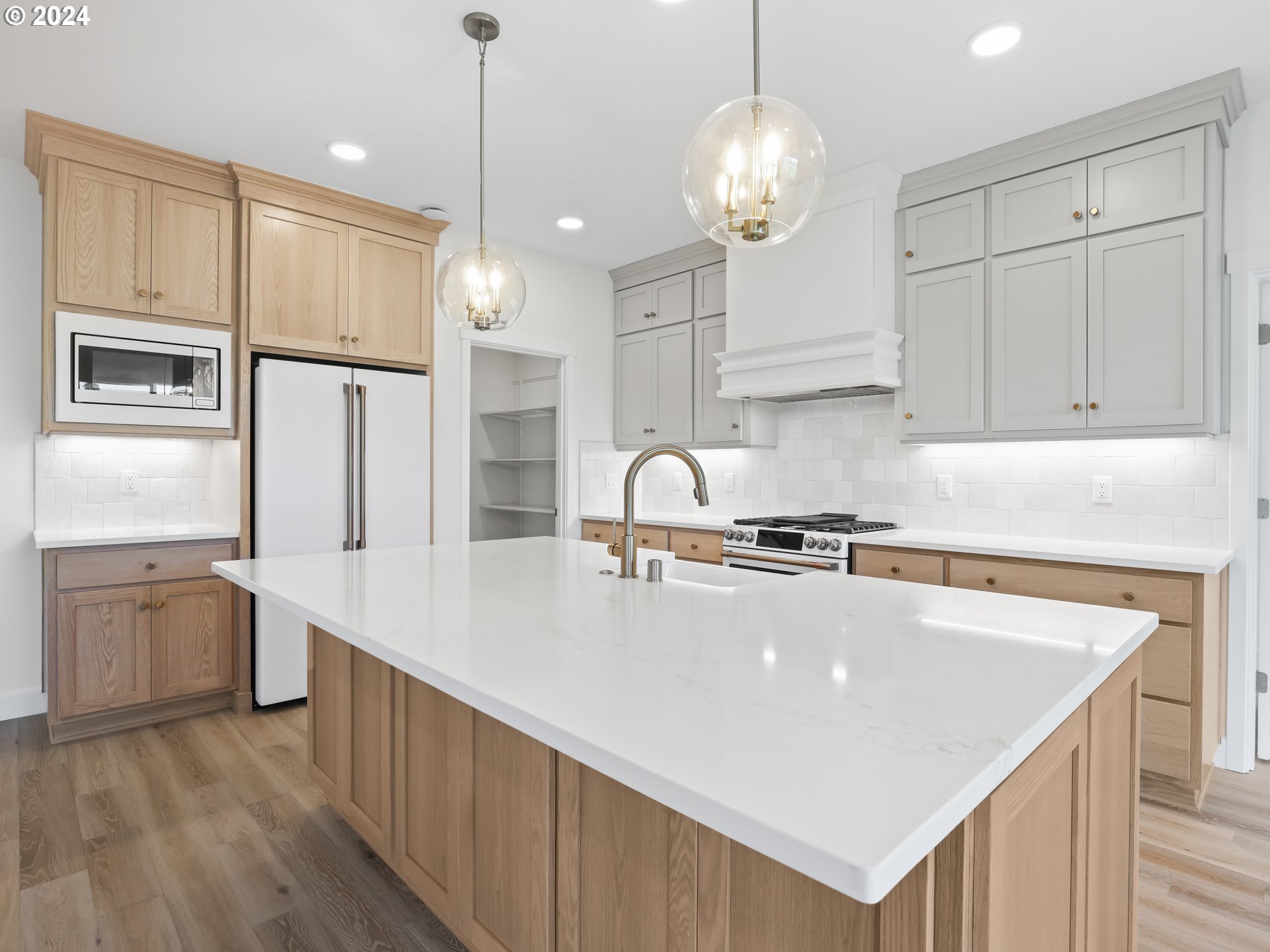 4400 North 12th Way Ridgefield, WA 98642 - Photo 11 of 31 a kitchen with stainless steel appliances granite countertop a sink refrigerator and cabinets