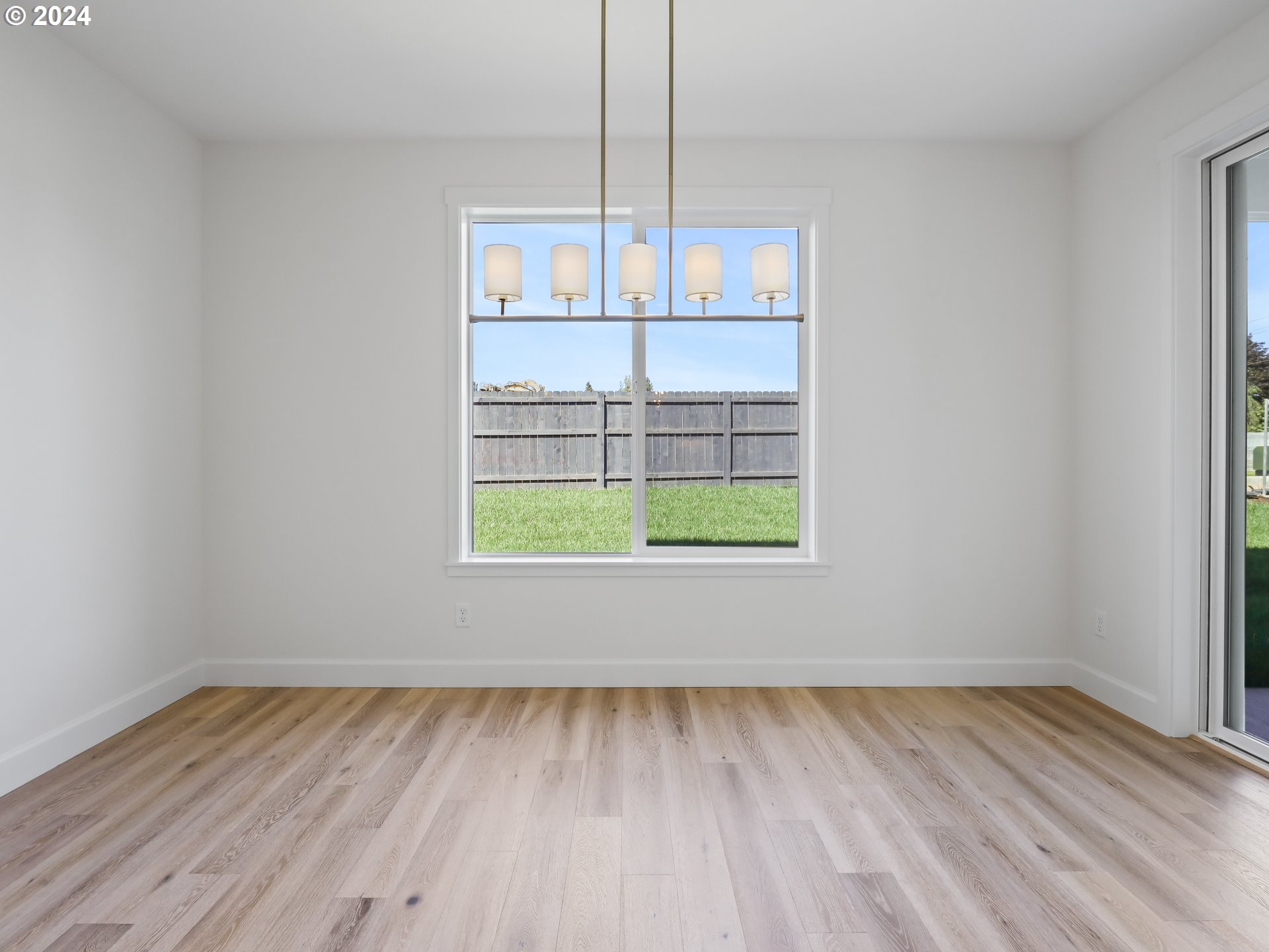 4400 North 12th Way Ridgefield, WA 98642 - Photo 17 of 31 a view of a room with wooden floor and window