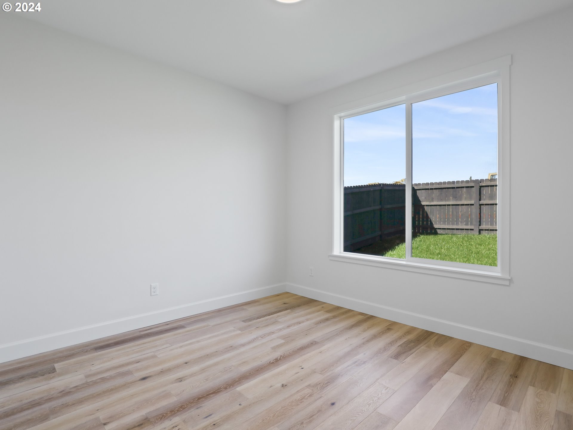4400 North 12th Way Ridgefield, WA 98642 - Photo 21 of 31 wooden floor in an empty room with a window